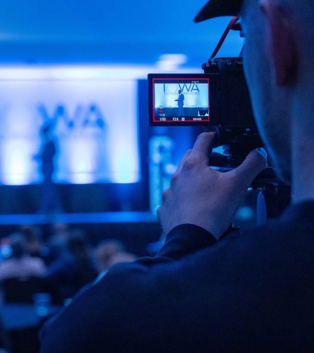Capturing a conference event with a focus on professional videography services.